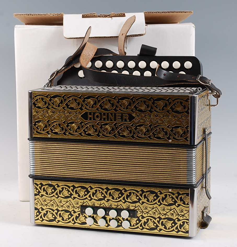 A modern Hohner Erica 21 button accordion, boxed.