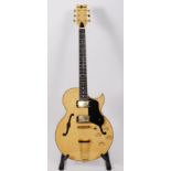 A Gear4music ES/295 electro/accoustic guitar, in natural finish