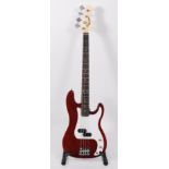 A Benson precision bass guitar, in red boxed as new