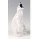 A Royal Copenhagen porcelain model of a Polar Bear, in seated roaring pose, printed backstamp and