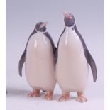 A Royal Copenhagen porcelain model of a pair of penguins, printed backstamp and numbered 2918 verso,