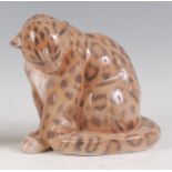 A Royal Copenhagen large porcelain model of a Panther, head down and in seated pose, printed