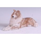 A Royal Copenhagen porcelain model of a ruff collie, in recumbent pose, printed backstamp and