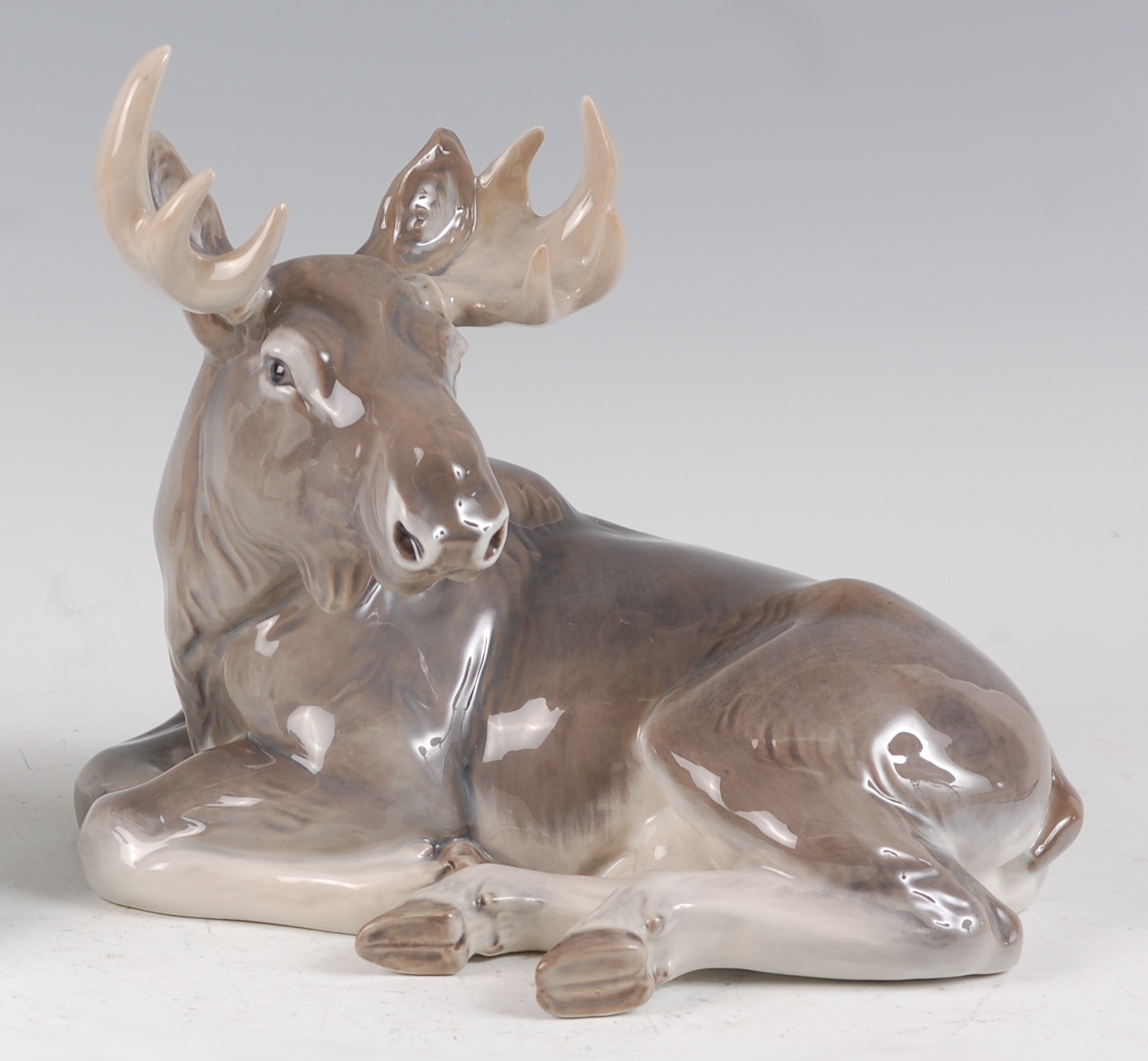 A Royal Copenhagen large porcelain model of an Elk, in recumbent pose, printed backstamp, numbered