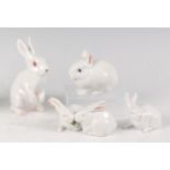 Four various Royal Copenhagen porcelain models of white Rabbits, each with printed backstamps and