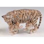 A Royal Copenhagen porcelain model of a Tiger and two cubs, in standing pose, the cubs playful,