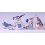 Seven various Royal Copenhagen porcelain model birds, comprising; Flycatcher perched on leaves,