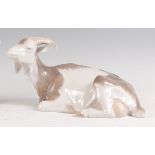 A Royal Copenhagen porcelain model of a recumbent Goat, designed by Christian Thomsen, printed