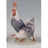 A Royal Copenhagen porcelain model of a Rooster and Hen, printed backstamp, numbered 1094 and