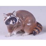 A Royal Copenhagen porcelain model of a racoon, printed backstamp and numbered 5401 verso, length