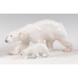 Two Royal Copenhagen porcelain models of a Polar Bear and Cub, each in walking pose, each with