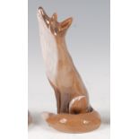 A Royal Copenhagen large porcelain model of a seated Fox, looking up, printed backstamp and numbered