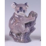 A Royal Copenhagen porcelain model of a Koala bear, clinging to a branch, printed backstamp,