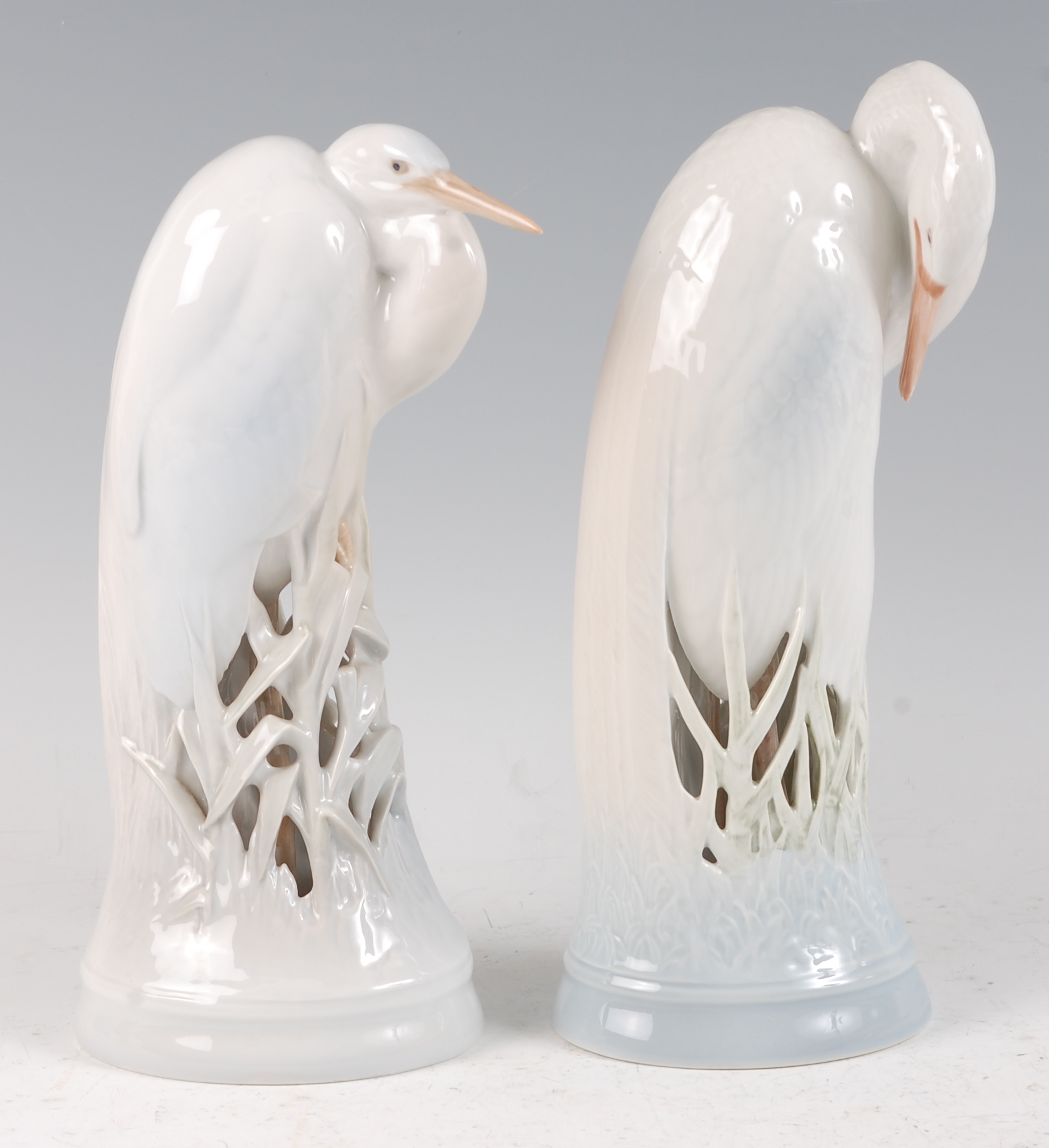 A pair of large Royal Copenhagen porcelain models of Heron, designed by Theodore Madsen, each with