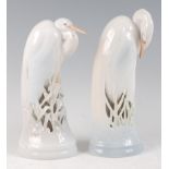 A pair of large Royal Copenhagen porcelain models of Heron, designed by Theodore Madsen, each with