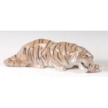 A Royal Copenhagen large porcelain model of a Tiger feasting, in recumbent pose, printed backstamp