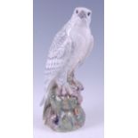 A Royal Copenhagen large porcelain model of an Icelandic Falcon, perched on acorn stump outcrop,