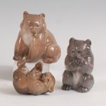 A Royal Copenhagen porcelain model of a seated Bear Cub, printed backstamp and numbered 1233/3015