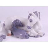 A Royal Copenhagen porcelain model of a mare and foal, in recumbent pose, printed backstamp and