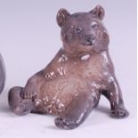 A Royal Copenhagen porcelain model of a seated brown bear, printed backstamp, numbered 1233/345