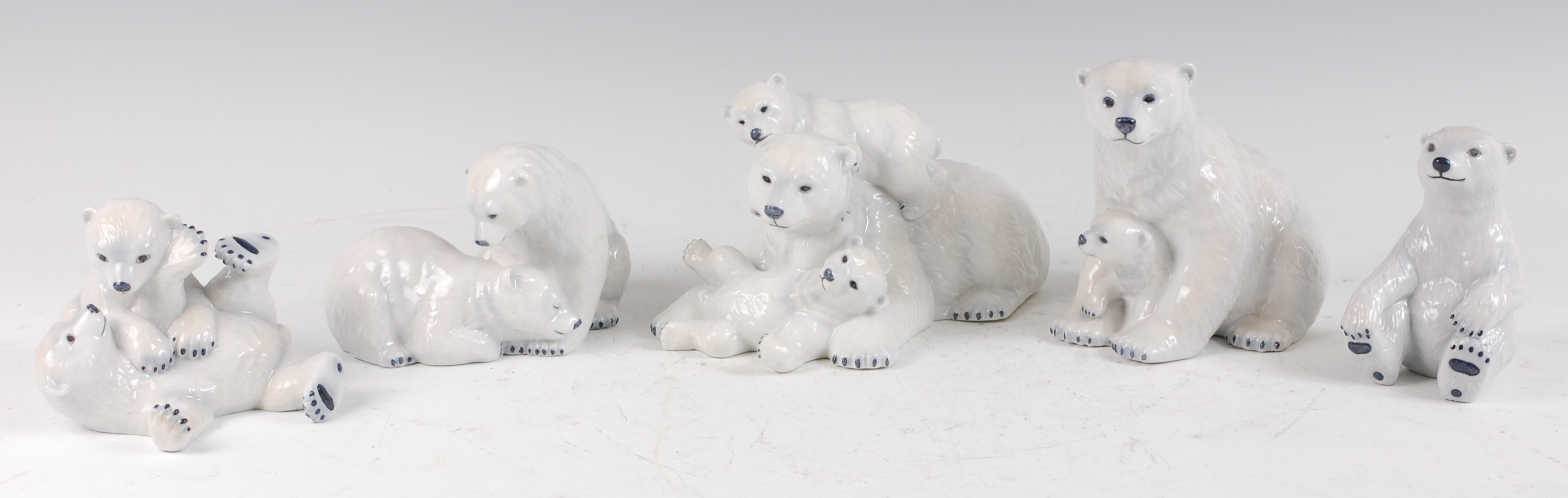 Five Royal Copenhagen porcelain models of Polar Bears, comprising mother bear in recumbent pose with