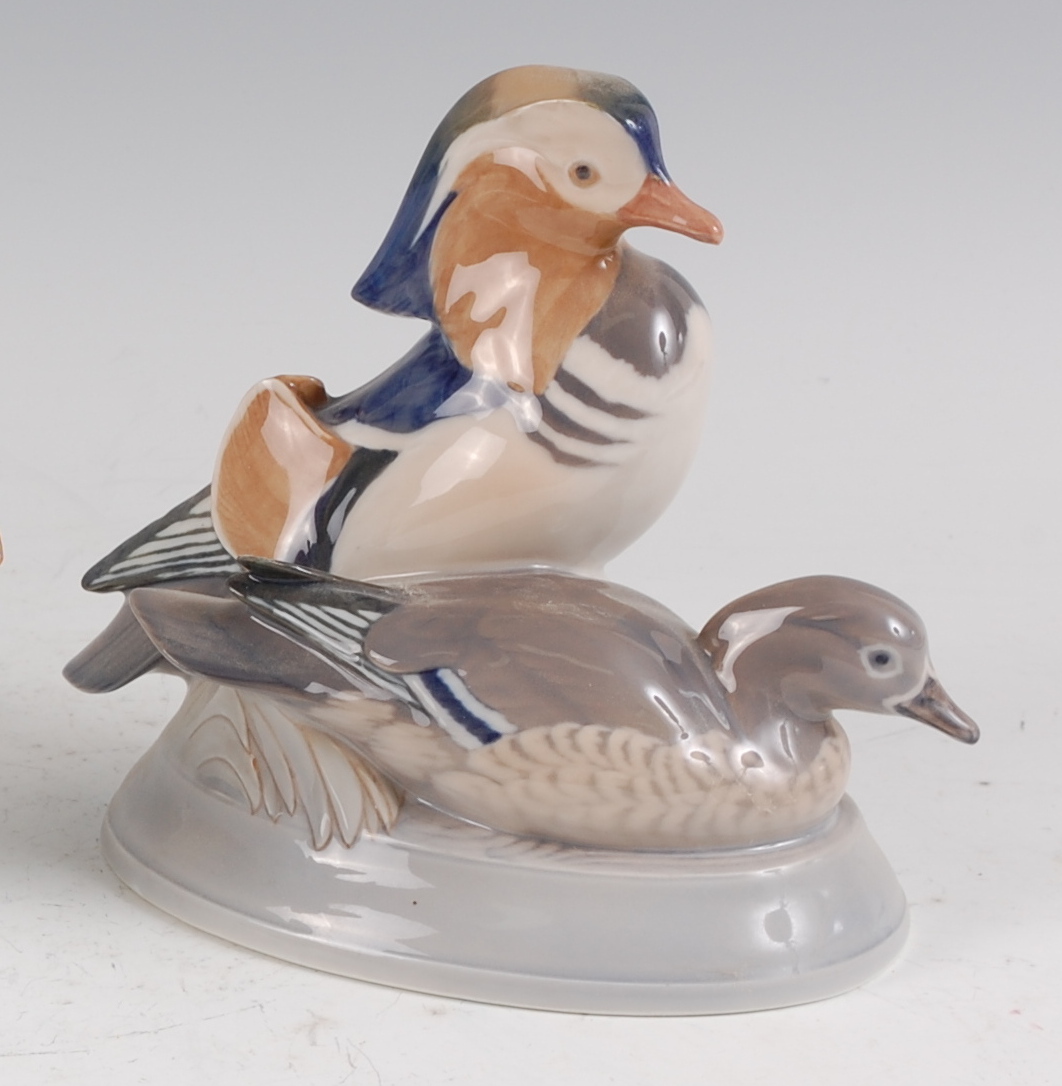 A Royal Copenhagen porcelain model of a pair of Mandarin Ducks, designed by Peter Herold, printed