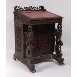 A 19th century Anglo-Burmese carved hardwood Davenport, having a three-quarter gallery, gilt