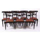 A set of seven George IV mahogany dining chairs, each having acanthus leaf carved top rails, drop-in