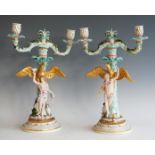 A pair of 19th century Meissen porcelain figural candelabra, modelled as Ganymede and Hebe, each