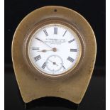 A late Victorian brass cased travel clock, the proud white enamel dial with Roman numerals and