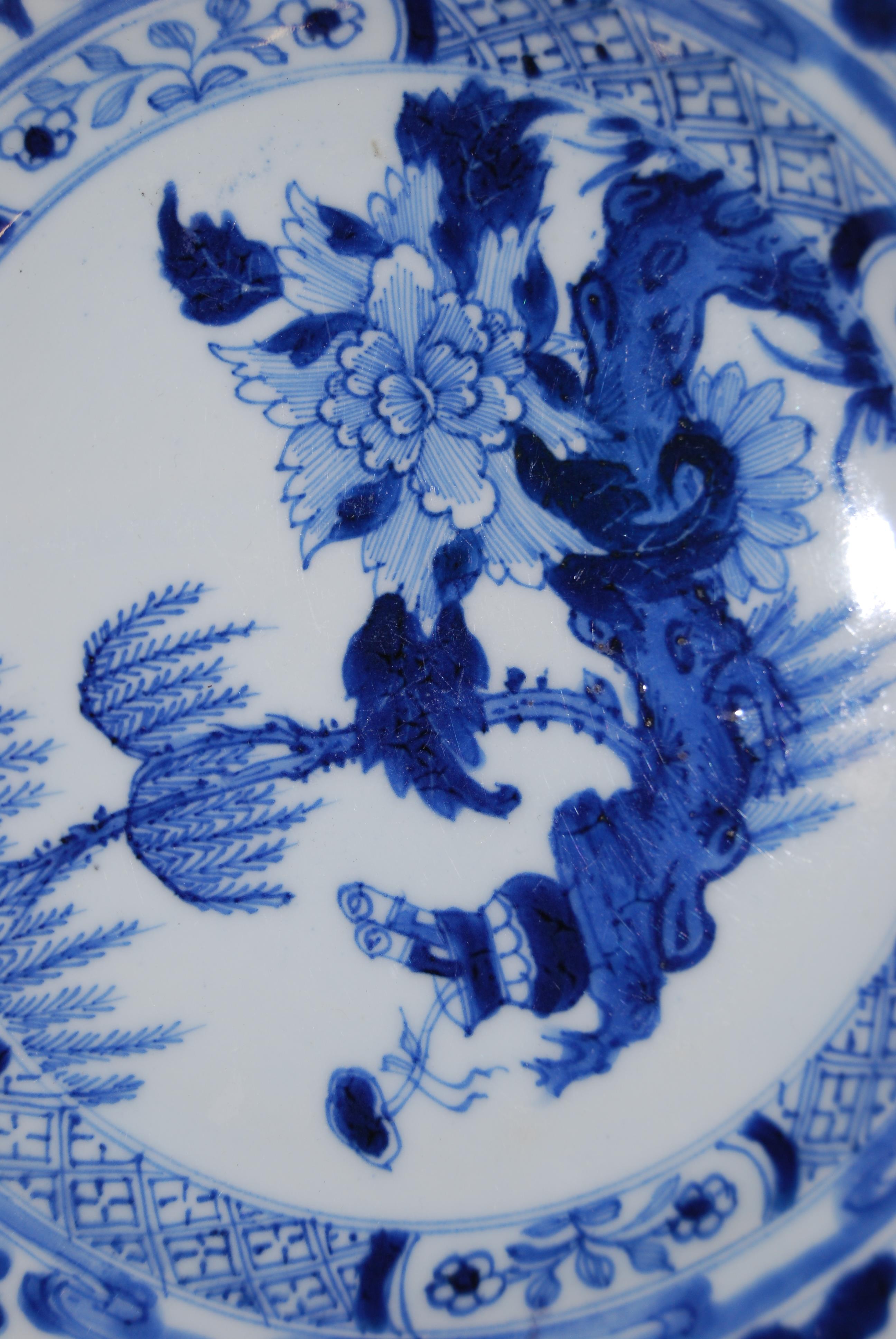 A set of four Chinese export porcelain blue and white plates, each decorated with chrysanthemums and - Image 5 of 8