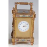 A 19th century French lacquered brass and champleve enamel four pillar carriage clock, having a