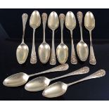 A set of eleven late 19th century continental silver gilt teaspoons, each having a plain bowl, the