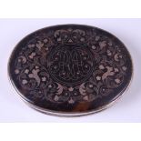 A 19th century white metal, tortoiseshell and pique work pocket snuff box, of oval form, the