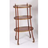 A late 19th century kingwood three tier etagere, bearing label for Edwards & Roberts, the three