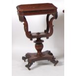 An early Victorian rosewood pedestal combination needlework and writing table, the hinged cover