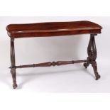 An early Victorian rosewood sofa table, of serpentine outline, raised on acanthus leaf capped lyre