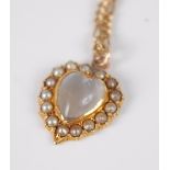 A moonstone and seed pearl heart shaped pendant , the collet mounted heart shaped moonstone with