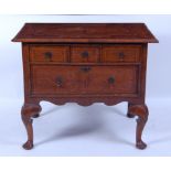 A walnut and seaweed marquetry lowboy , early 18th century and later adapted, having a four-