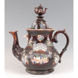 A Victorian Meacham / bargeware treacle glazed teapot and cover, of good size, with applied floral