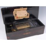 A circa 1900 Swiss rosewood cased music box, the 6" cylinder playing eight airs, with stop-start and