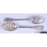 A pair of George III Irish silver berry tablespoons, in the Fiddle pattern, having later chased