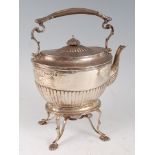 A Victorian silver spirit kettle on stand, the kettle of half-fluted oval form, the stand having