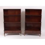 A well matched pair of 19th century mahogany waterfall bookcases by Gillows of Lancaster