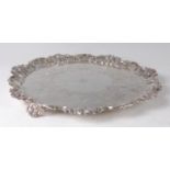 An early Victorian silver salver, having acanthus leaf cast raised piecrust rim, further C-scroll