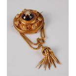 A late Victorian yellow metal garnet set fringe brooch, with tassel drop, the cabochon garnet(?)
