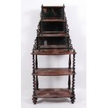 A Victorian walnut six-tier whatnot, the graduated upper three tiers with mirrored back and fret