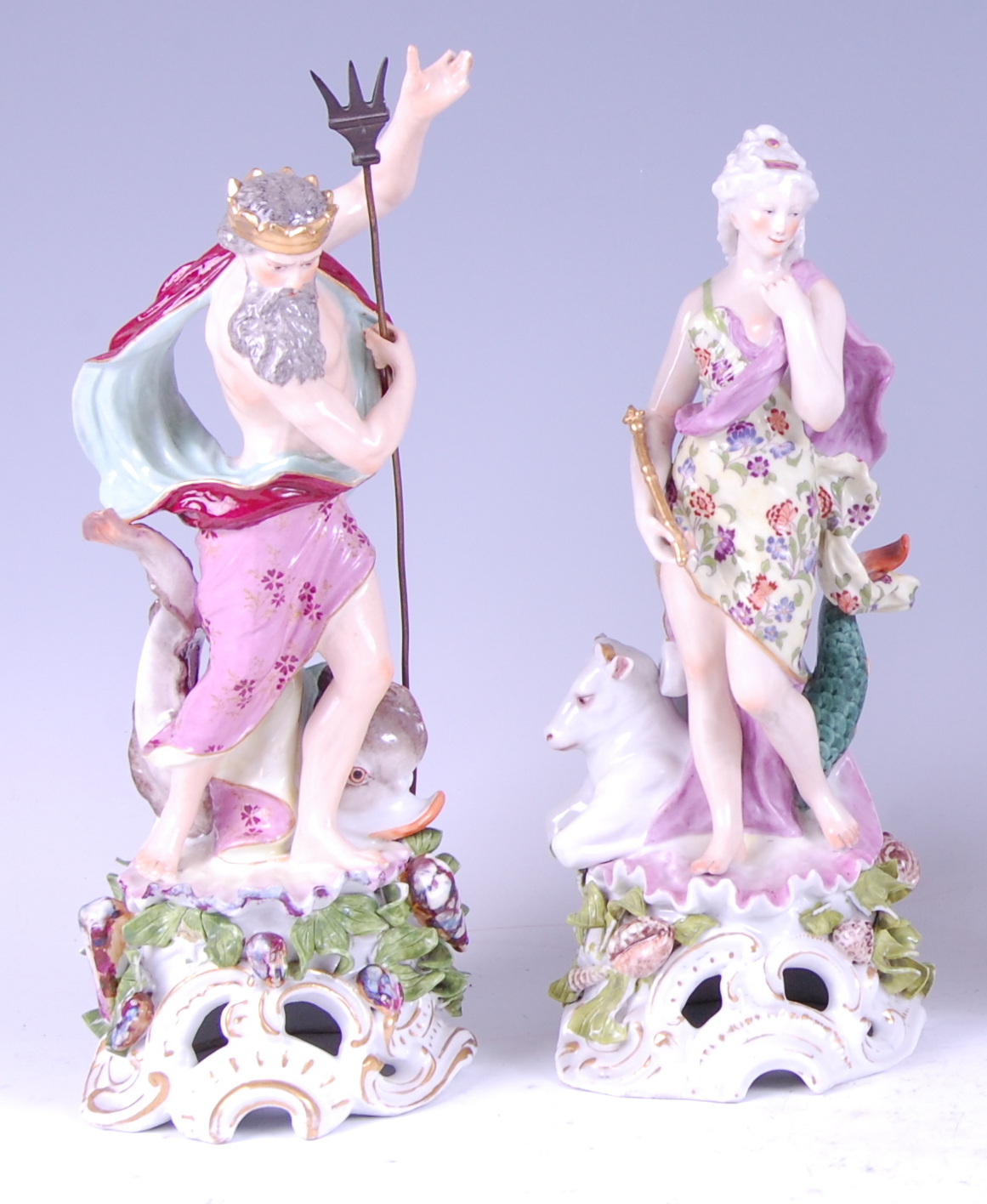 A pair of late 19th century Meissen Dresden figures of Neptune and Doris, each in robed standing