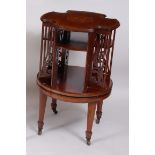 An Edwardian mahogany, satinwood banded and further inlaid revolving bookcase, of shaped circular