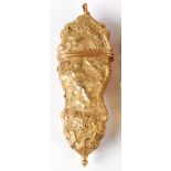 A George III gilt metal etui, worked in high relief with a figure to either side, within C-